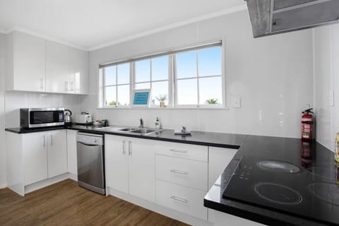The kitchen has everything you need to create meals including a oven, cooktop, dishwasher, fridge/freezer and microwave.