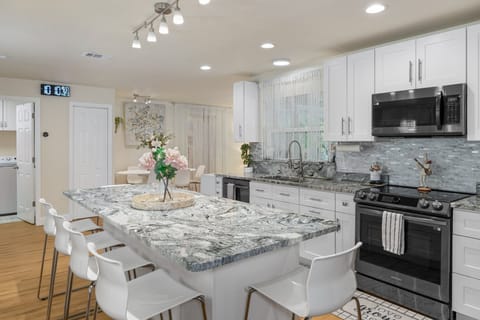 Fully remodeled kitchen with kitchen island.
