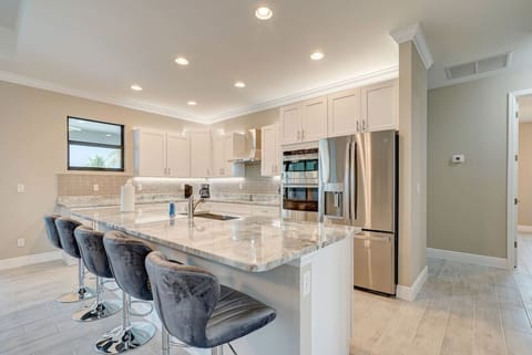 Kitchen with Island and 4 Bar Stools