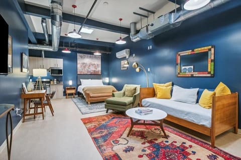 Bold, funky, and full of character—this industrial-inspired studio is the perfect blend of style and comfort.
