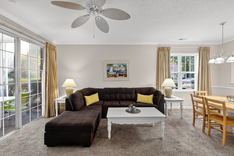Living Room - Open and welcoming living space with plenty of natural light — perfect for relaxing with family and friends after a day of activities.