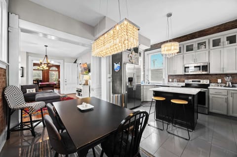 Kitchen: Marble countertops, sleek appliances, and exposed brick – your perfect cooking haven awaits!