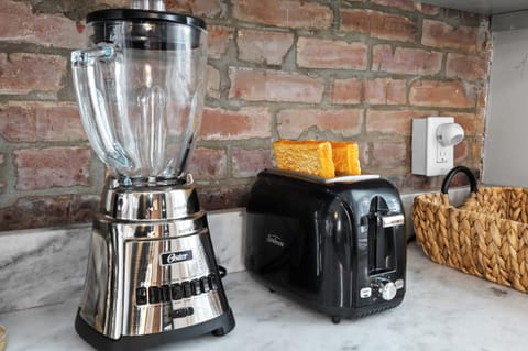 Kitchen: Marble countertops, sleek appliances, and exposed brick – your perfect cooking haven awaits!