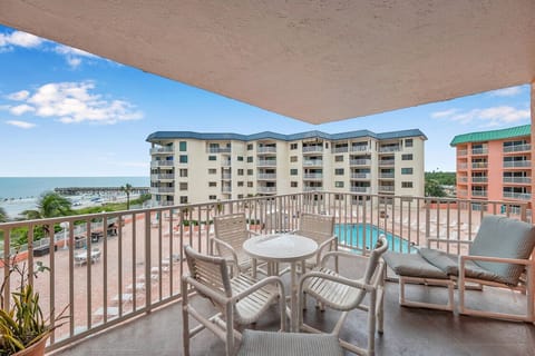 Balcony view overlooking the pool area, perfect for soaking in the coastal atmosphere.
