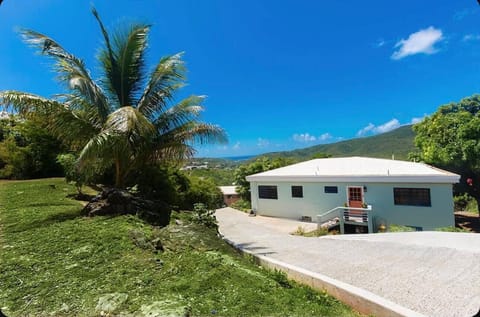 Front of home with private driveway and on-site parking.