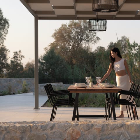Enjoy a culinary delight in the luxurious outdoor dining space.