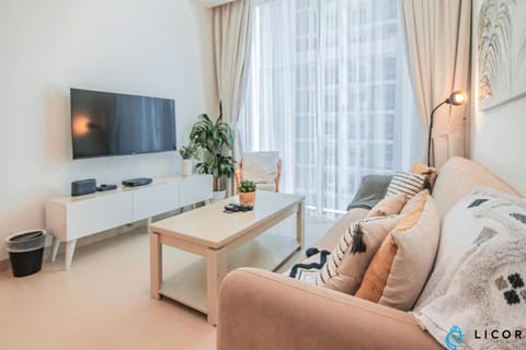 Enjoy a bright and airy open-plan living area, featuring comfortable seating, a dining space, and a fully equipped kitchen, all designed for your comfort and convenience.