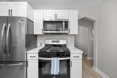 Brand new kitchen offers - quartz countertops, all new stainless steel appliances (fridge, gas stove, microwave, dishwasher), coffee maker with pot and k-cup, pots/pans, cooking and baking and eating utensils, spices, and cooking basis.