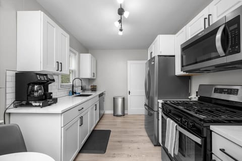 Brand new kitchen offers - quartz countertops, all new stainless steel appliances (fridge, gas stove, microwave, dishwasher), coffee maker with pot and k-cup, pots/pans, cooking and baking and eating utensils, spices, and cooking basis.