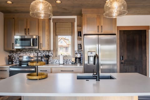 Gather around the kitchen island as meals are made in the full kitchen