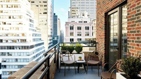 Sip morning coffee on the balcony with sweeping city views.