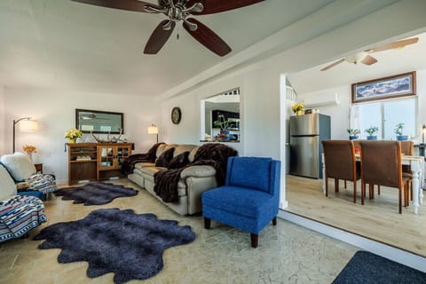 The living room is seamlessly connected to the kitchen and dining area.