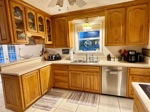 Kitchen window overlooks backyard