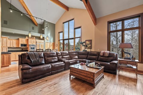 The living room has a spacious sectional sofa with built-in recliner chairs.