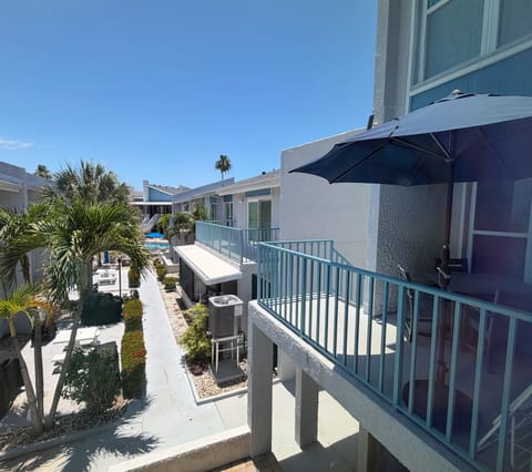 View of the front balcony and view of the pool that is just a fe - View of the front balcony and view of the pool that is just a few steps away!