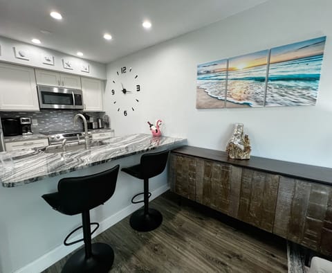 Bar stool seating off of the open concept kitchen. plus storage - Bar stool seating off of the open concept kitchen. plus storage space for anyone sleeping on the sleeper sofa.