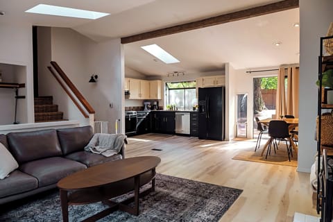 Large, open main floor with living/kitchen/dining. 