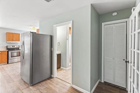 Bathroom door by fridge