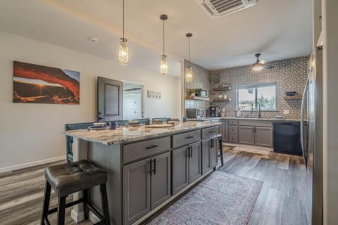 This kitchen offers a seamless flow to dining and living areas, creating the perfect space for connection.