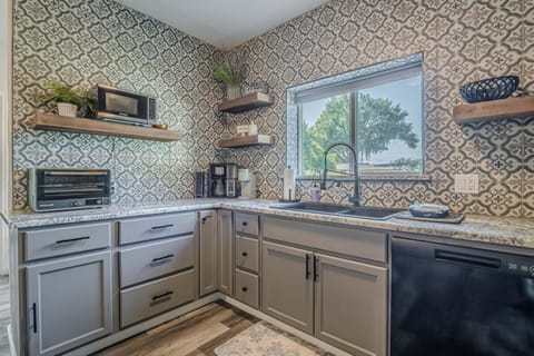 Whether cooking a feast or enjoying a morning coffee, this kitchen has everything you need.