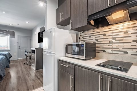 Whip up quick bites with fridge, microwave, and cooktop.