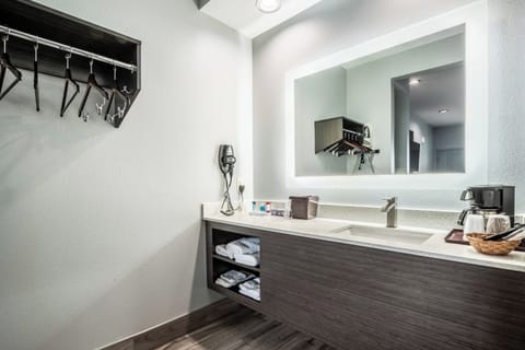 Soak and reset in a clean bath with simple finishes.