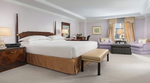 Unwind in a spacious suite with plush king bed.