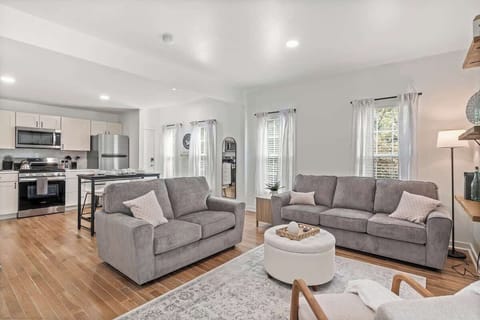 This apartment is restful and welcoming with natural light, comfortable couches and a large kitchen.