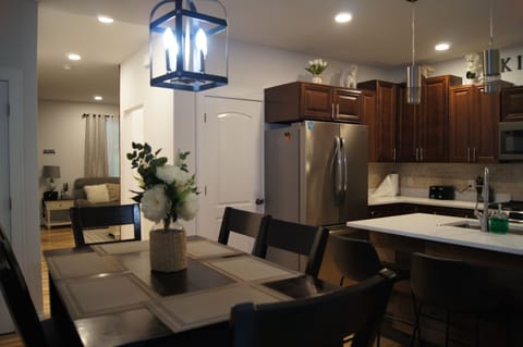 Dining, Island and Kitchen off of Living Room with back deck access