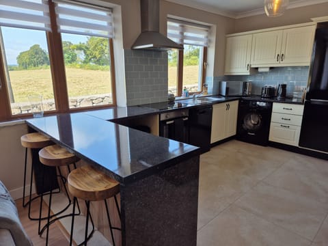 Bright, airy kitchen with breakfast bar!