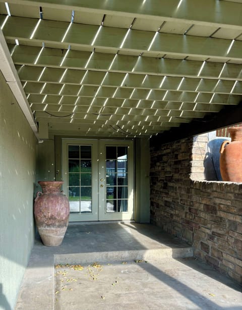 French doors under the deck leading to theater room