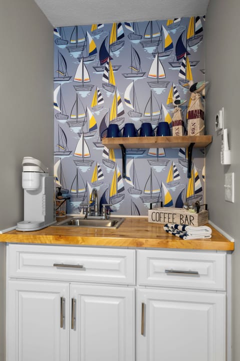 In-studio coffee bar with nautical flair—includes Keurig, mugs, and everything for your morning brew.