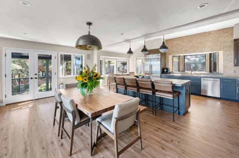 Kitchen & Dining Room: Well-equipped kitchen, 2 ovens, 6-burner stove, kitchen bar w/5 bar stools, 11-person dining table