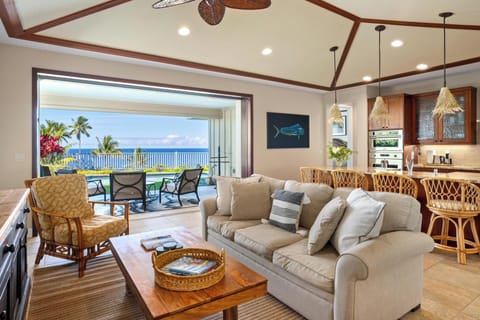 Spacious living area with views opens up to the lanai