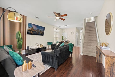Stylish black and cyan accents, comfy seating, perfect for relaxing.