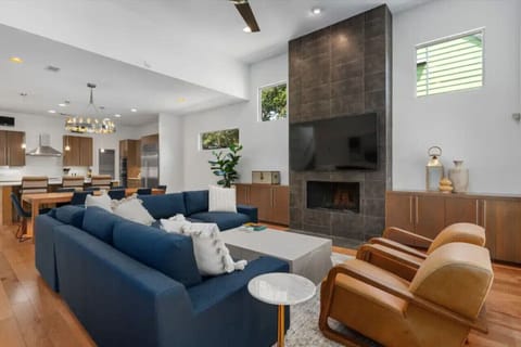 Cozy living area with a fireplace, open to the kitchen.