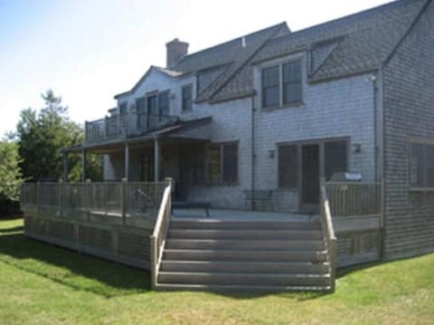 LARGE MAHOGANY DECK WITH COVERED AREA AND BALCONY