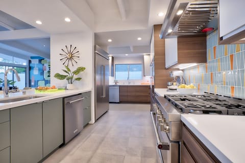 New kitchen- 10' island. KitchenAid gas range, 48" fridge/freezer, 2 D/Ws.