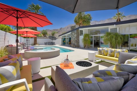 Outdoor seating area with firepit and mountain views