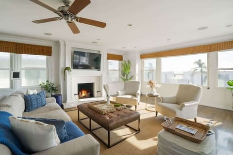 Relax by the fire in style with sun-filled, open concept living