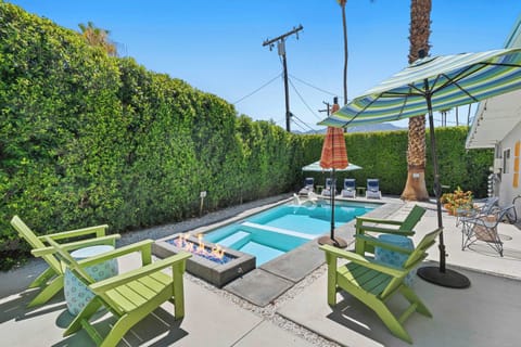 Backyard oasis with ample outdoor seating and firepit 
