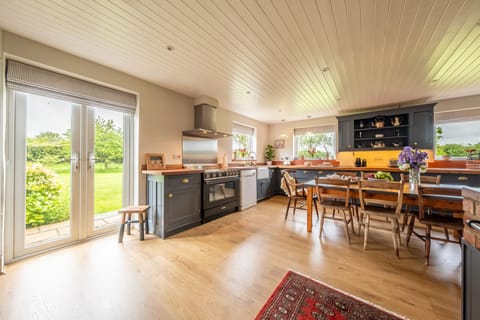 Ground floor: Kitchen with dining table and french doors to garden