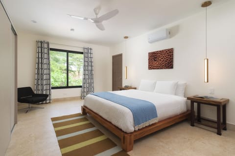 Upstairs master bedroom overlooking the pool & trees where monkeys love to play