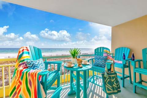 Welcome to Pelican Isle 215 - The Emerald Spritz! Sip your morning coffee on your private balcony while watching waves dance across pristine white sand.