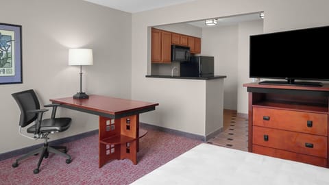 Work comfortably at the desk, then refuel in your kitchenette.