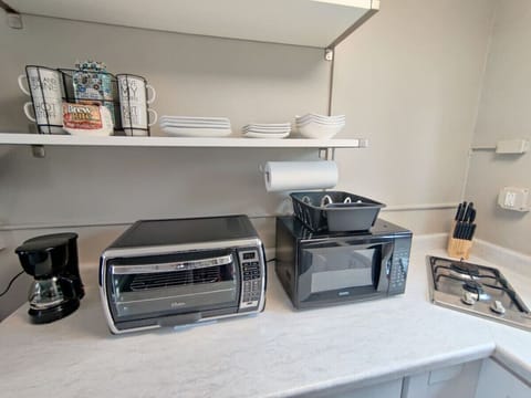 Coffee maker with coffee and tea selections are available. Included is a two burner stove top, microwave, and convection oven.