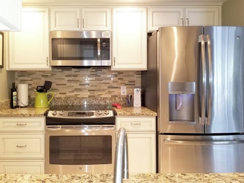 FULL KITCHEN WITH STOVE, MICROWAVE, REFRIGERATOR, DISHWASHER, APPLIANCES, ETC.
