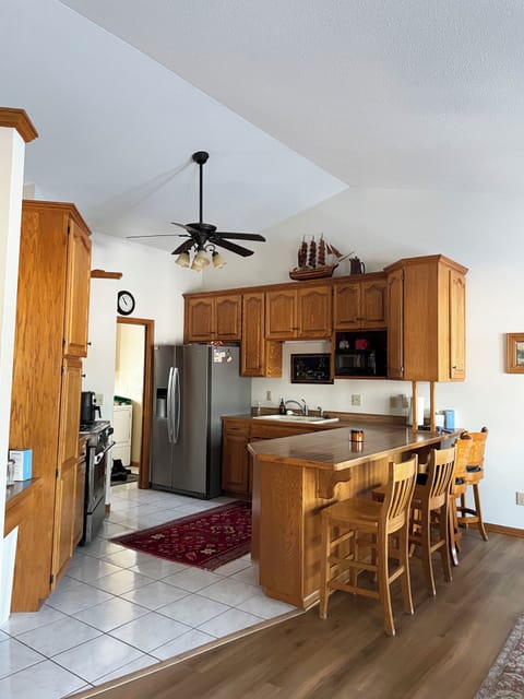 Open kitchen. Gas range, dishwasher, large fridge