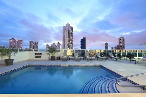 Soak up skyline views while you lounge by the pool.