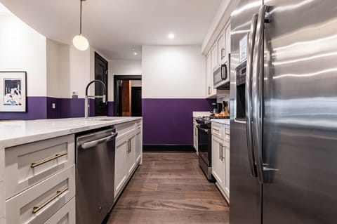 Cook or snack in style with a full kitchen featuring GE stainless appliances, cookware, and an island with bar seating. Ideal for short or extended stays, our kitchens make group travel in New Orleans easy and comfortable.